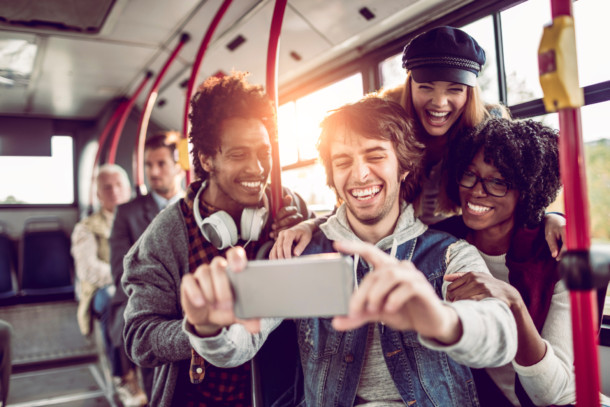 Friends taking a selfie in a bus
